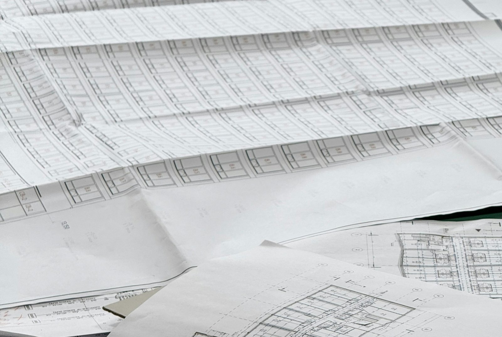 Architectural floor plans and renovation planning documents used to prepare an interior design quotation