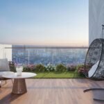 Contemporary high-rise apartment balcony garden with layered green plants, compact seating and weather-conscious finishes