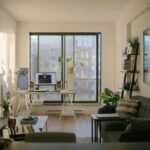 Functional home office with desk, comfortable chair, task lighting and natural light