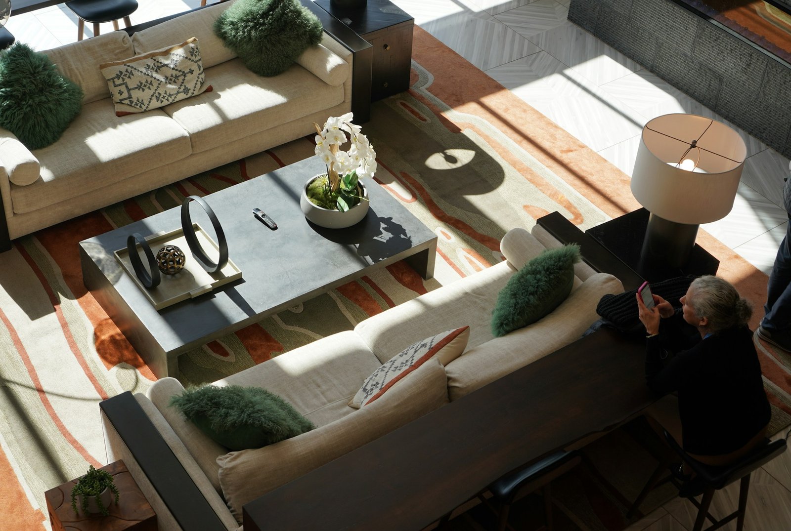 Homeowner reviewing interior design plans with a design professional in a contemporary living space