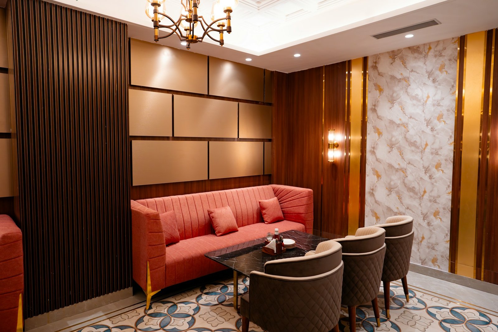 Contemporary builder floor living room with warm lighting, modern seating and wood accents, illustrating interior design costs in Gurgaon