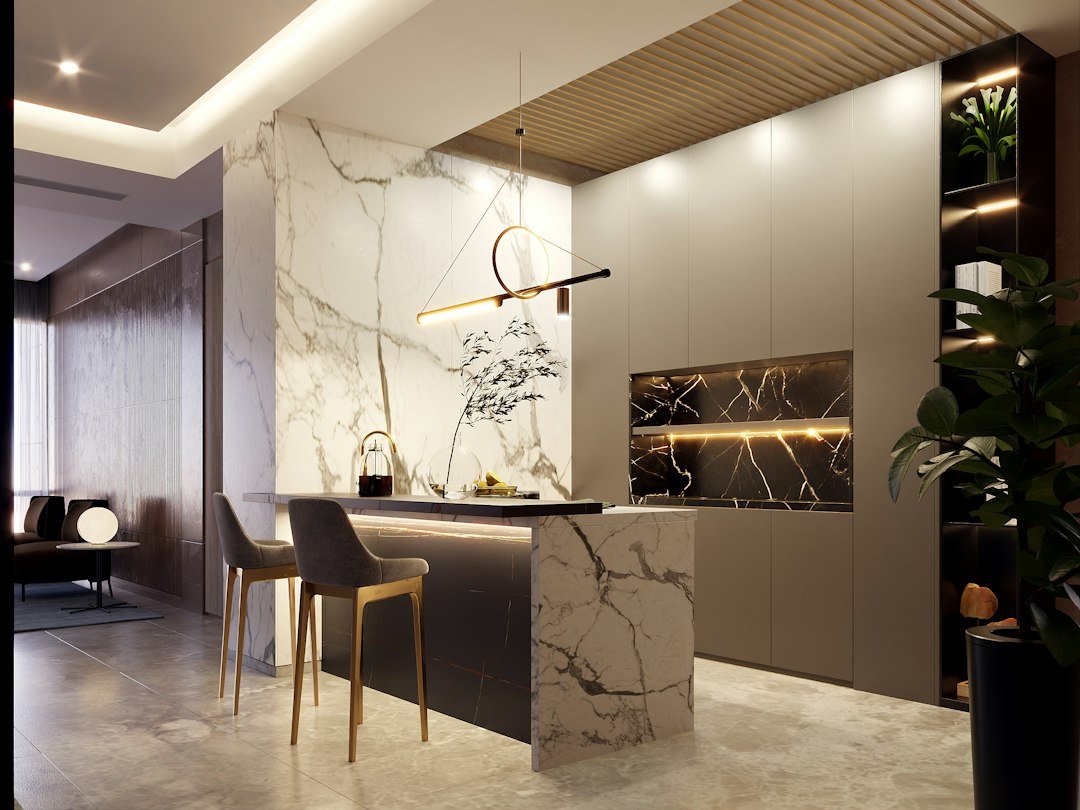 Modern kitchen with neutral cabinetry, stone island and warm layered lighting