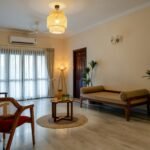 Bright rental apartment living room with freestanding furniture, neutral furnishings and natural light