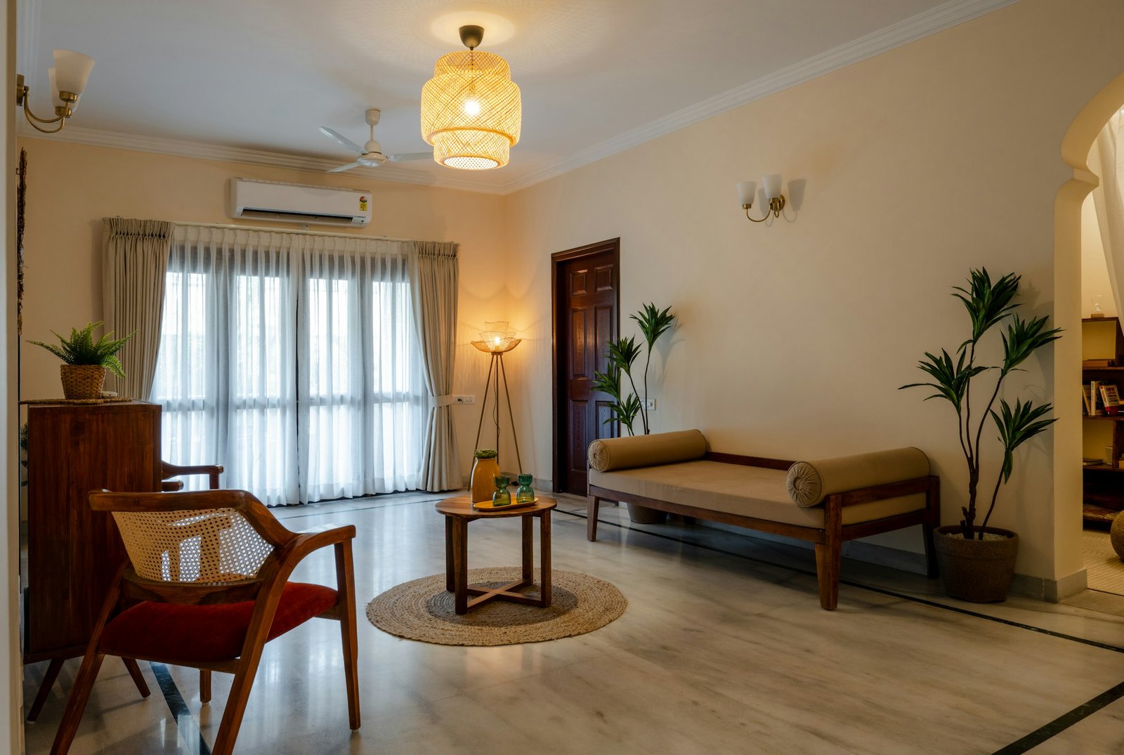 Bright rental apartment living room with freestanding furniture, neutral furnishings and natural light